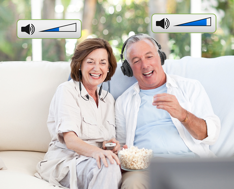 Older couple eating popcorn and watching a movie with graphics displaying individual audio control for their own headphones