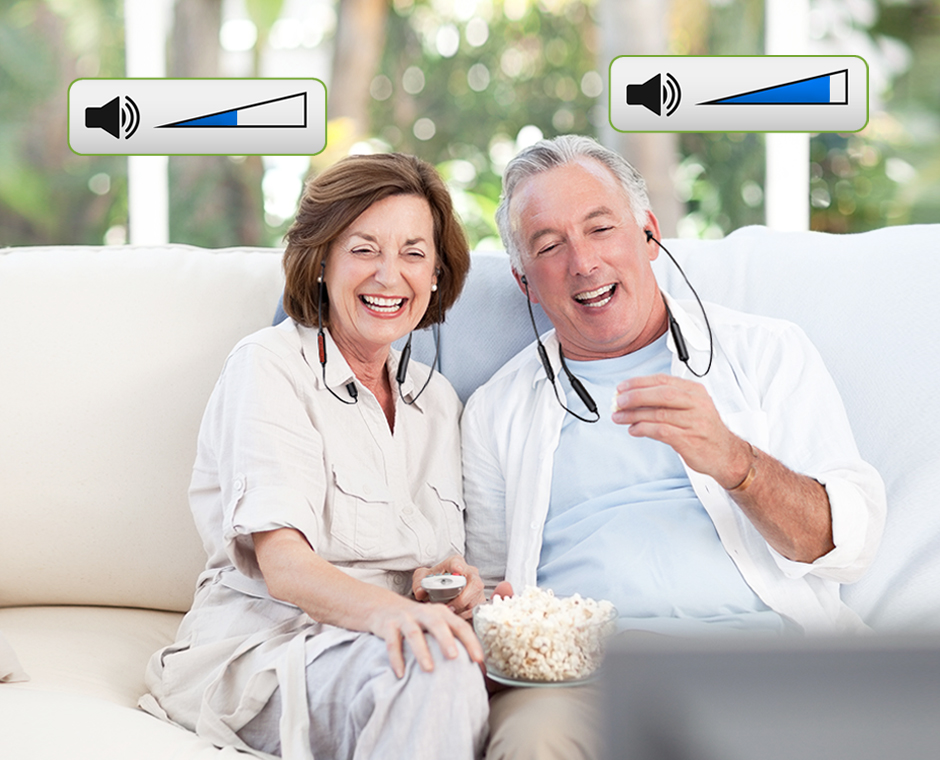 Couple on couch with popcorn; on each a HT41866 headphone, an audio control icon over each headphone showing different levels