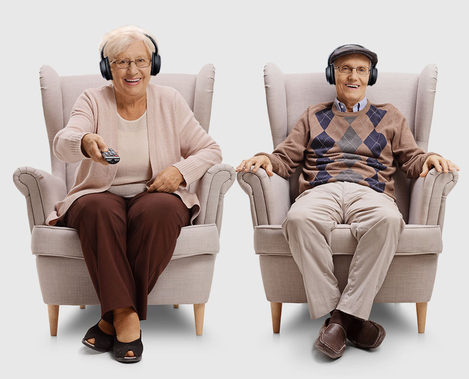 Elderly couple each wearing Avantree Opera's AS90C headphones and listening to TV, no lip sync delay.